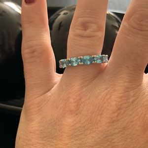 Blue topaz eternity band
